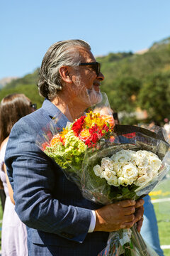 Man Holding Bouquet Outdoor Celebration