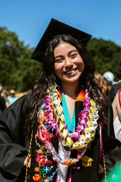 Woman in Cap and Gown Portrait Outdoors