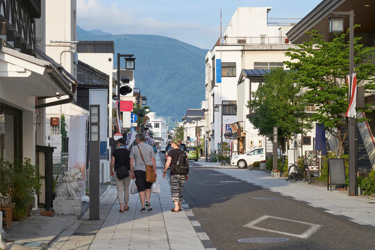 Tourists explore the narrow streets of Matsumoto, Japan