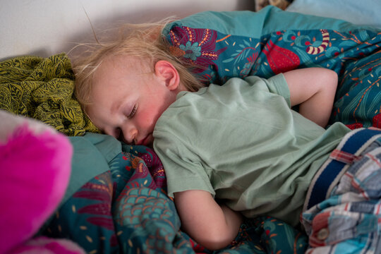 Little girl sleeping on her belly 