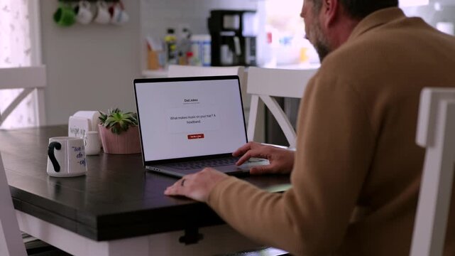 Middle Aged Man Testing Classic Dad Joke Generator Web Application - Dad Jokes On Demand Comic Relief Concept