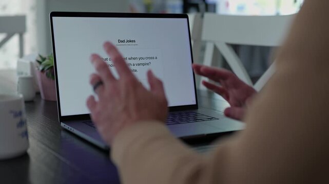 Middle Aged Man Testing Classic Dad Joke Generator Web Application - Dad Jokes On Demand Comic Relief Concept