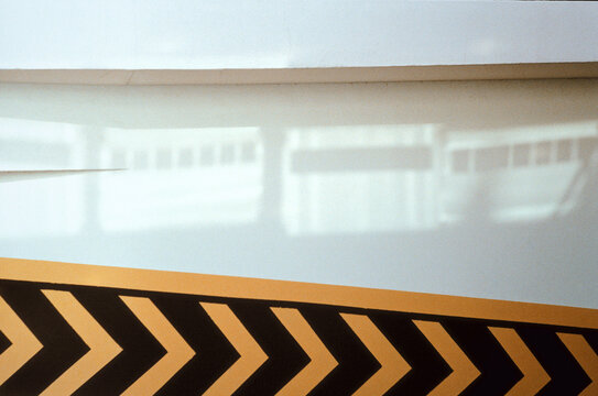 Sunlight reflections on urban wall