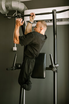 A man is working out in the gym.