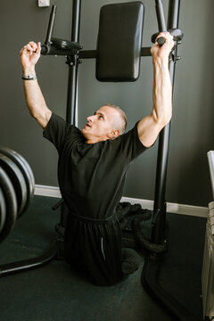 A man is working out in the gym.
