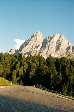 Empty mountain road in the Dolomites captured on analog film.