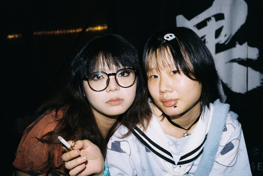Y2K Nightlife Portrait of Two Friends in Direct Flash