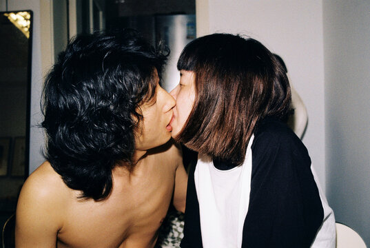 Capturing a romantic kiss between two people
