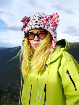 Bold Neon Explorer with Playful Winter Style in the Mountains