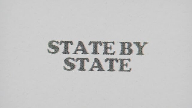 CMYK Halftone Text State By State Printed on Changing Paper with Vintage Stop Motion Effect.