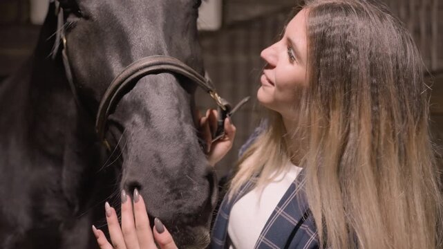 Girl checks horse. Student observes horse closely. Young woman gently inspects horse face. Female student meticulously observes and interacts with horse to build trust and understanding