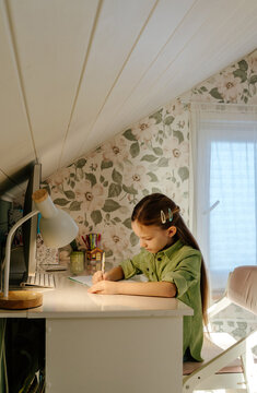 Focused Studying at Home Desk in Bright and Calm Interior