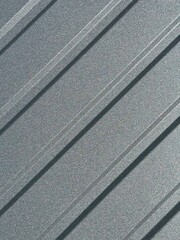 Fototapeta premium Graphite gray corrugated metal sheet for fencing and roofing. Metal profile sheet background