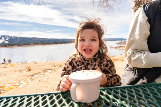 cheerful toddler enjoying snacks