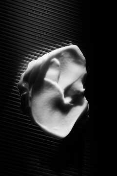 skincare lotion smear over black background