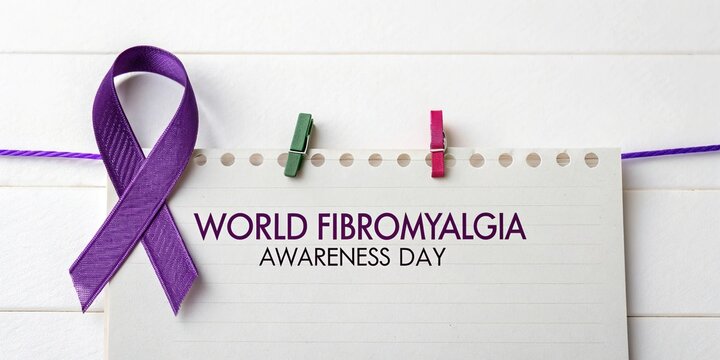Purple ribbon fibromyalgia awareness symbol on white background world day concept