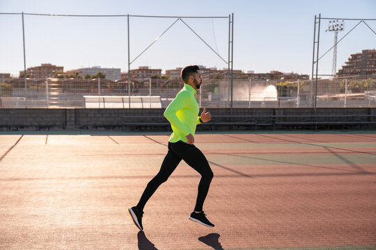 Athletic man in sportswear running 