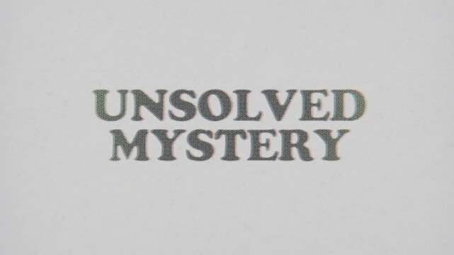 CMYK Halftone Text Unsolved Mystery Printed on Changing Paper with Vintage Stop Motion Effect.