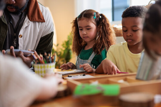 Children and teacher engaged in a learning activity.