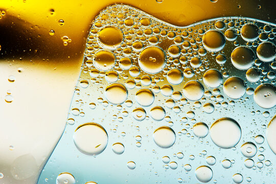 Golden Oil Bubbles in Cosmetic Serum Macro