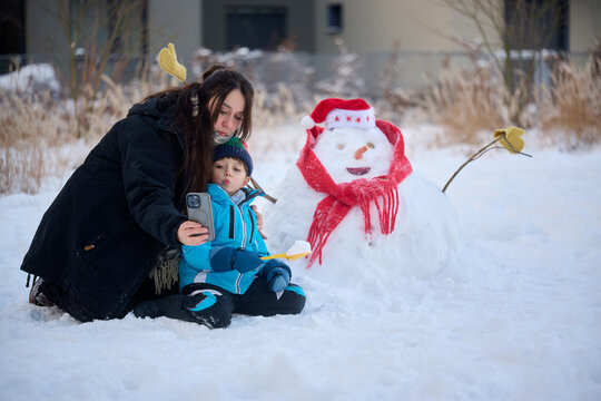 Mother and Child Playing in the Snow