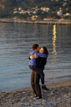 Siblings fool around on the beach