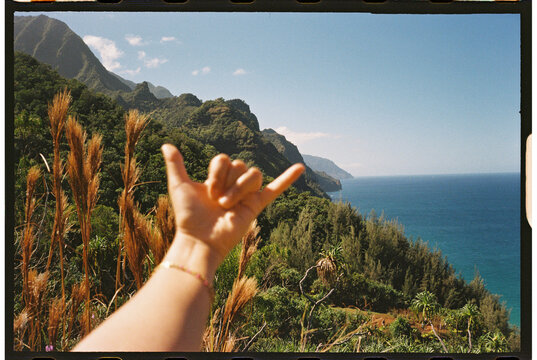 hang ten shaka sign hand gesture kauai vacation scenic view
