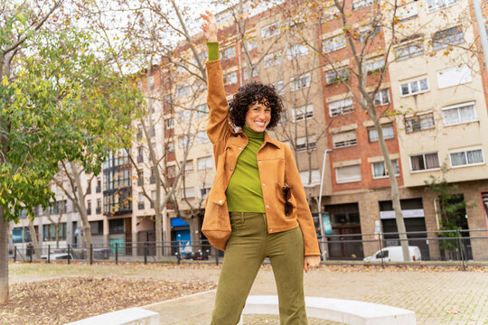 Happy woman dance city