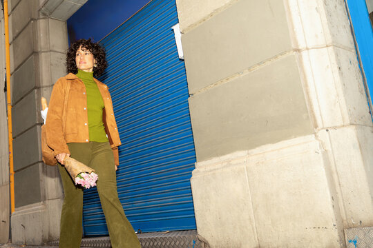 Woman walking with flowers