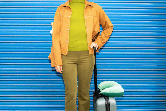 Woman with suitcase outdoors