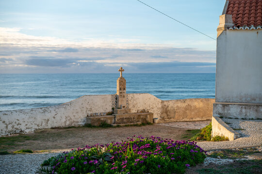Church and cross by Atlantic Ocean