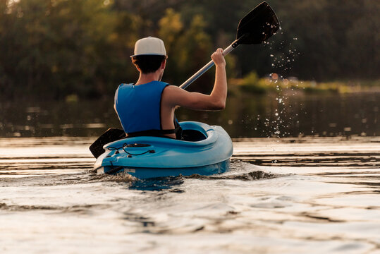 Teen boy kayaking 
