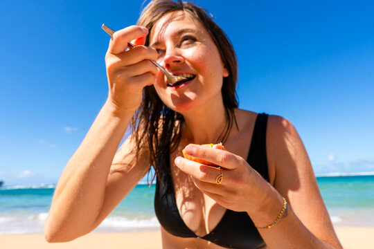 eating fruit beach