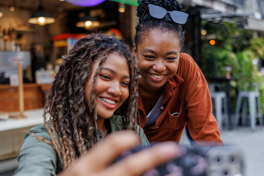 Lesbian couple takes selfie while traveling