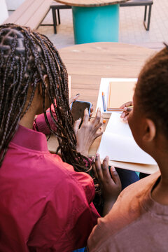 Students complete assignments together.