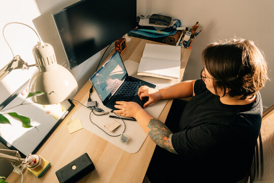Working at a Desk With Laptop During Daytime