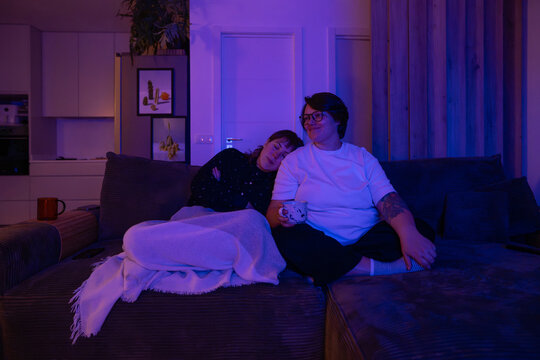 Couple Spends Evening Playing Video Games on Sofa Together