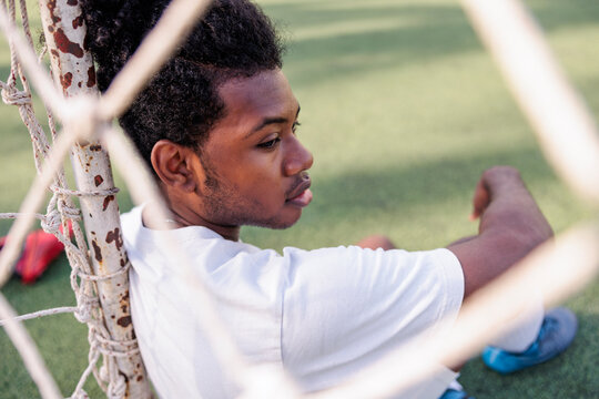 Sad young soccer player