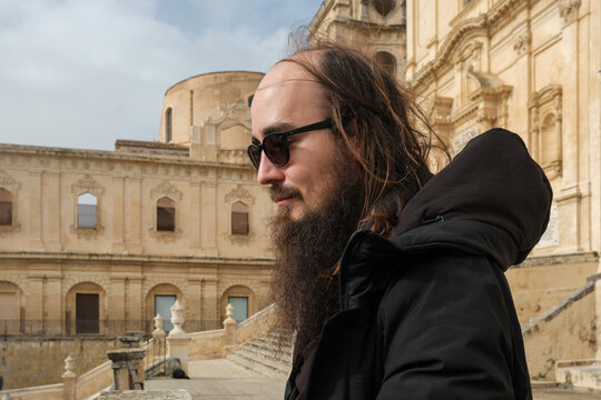 Bearded Tourist Walking Near Cathedral