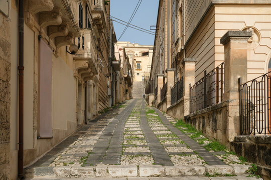 Narrow Stone Alley with Patterned Pavement