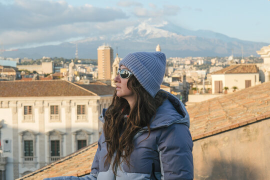 Woman Enjoying City View from Elevated Terrace
