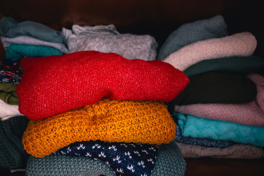 Colorful Pile of Sweaters, winter wardrobe