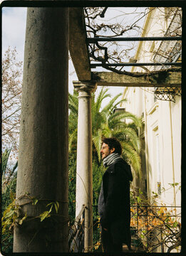 Man standing among columns