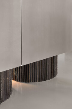 Ceramic base of kitchen island with stainless steel facade