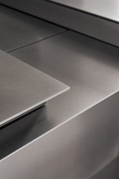 Stainless steel kitchen island detail with minimalist construction