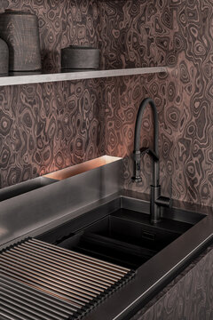 Minimalist kitchen sink with matte black faucet