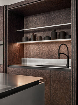 Modern kitchen shelving with integrated sink and textured wood surface
