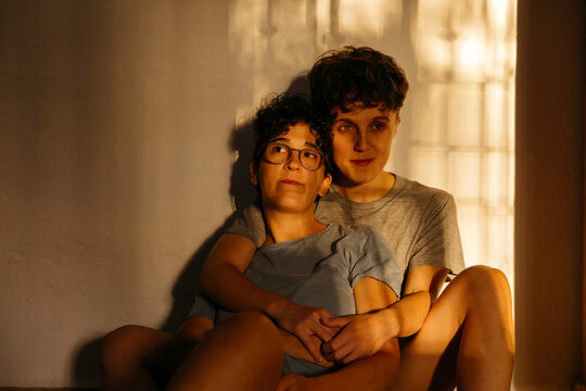 Two women resting together in warm sunlight