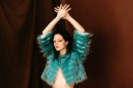 Womanin blue faux fur jacket