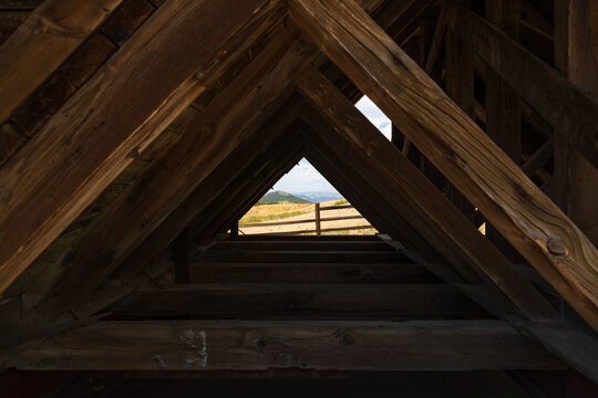 Mountain landscape looking through rafters